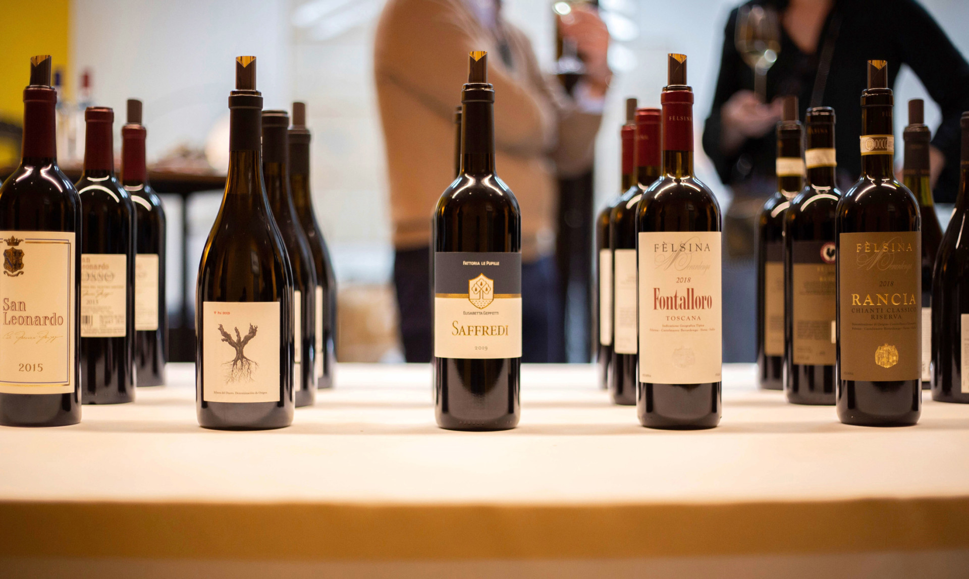 Row of wine bottles ready for a wine tasting event